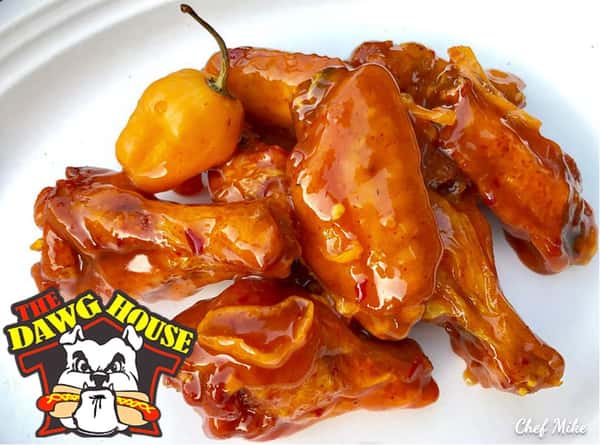 Mango habanero wings tossed in sauce